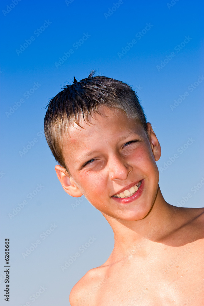 portrait series: summer boy portrait over blue sky portrait series: summer boy portrait over blue sky