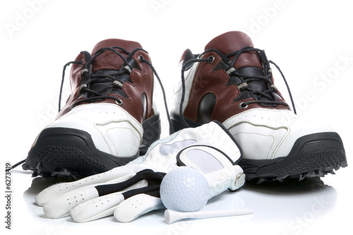 Golf shoes,Ball,Glove and Tee. High key shot.