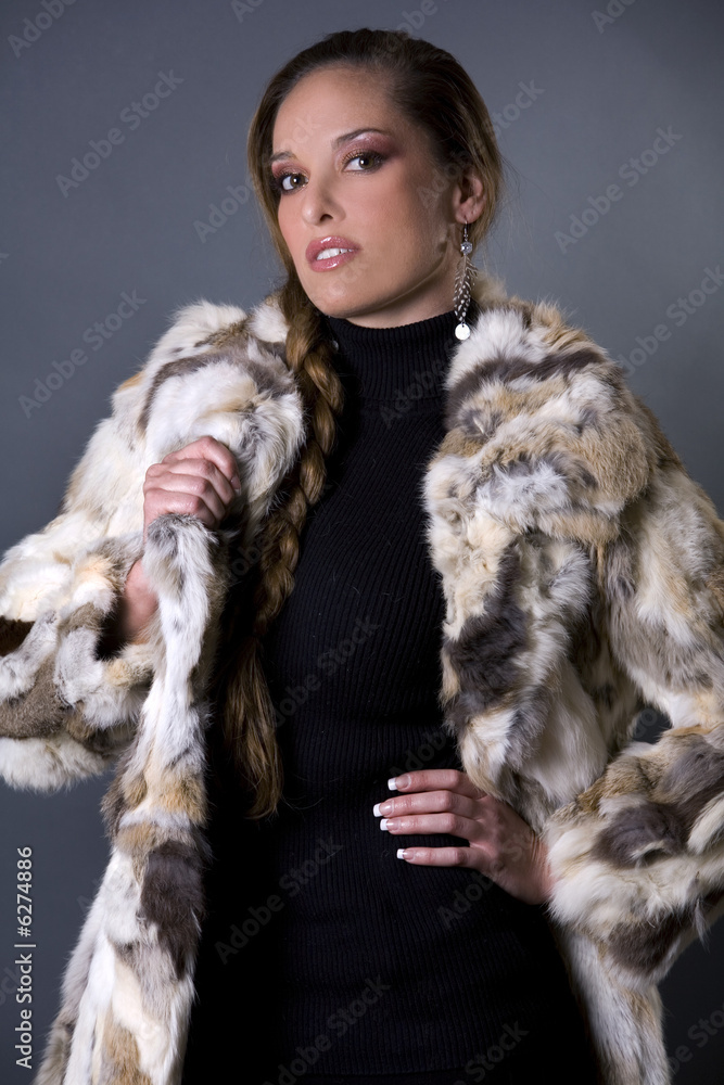 pretty model wearing fur coat and black pants indoors pretty model wearing fur coat and black pants indoors