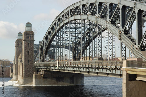 Bridge across the river. Blue sky. © katykin