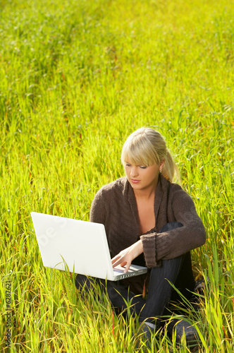beautiful sexy woman portrait at outdoors working on laptop