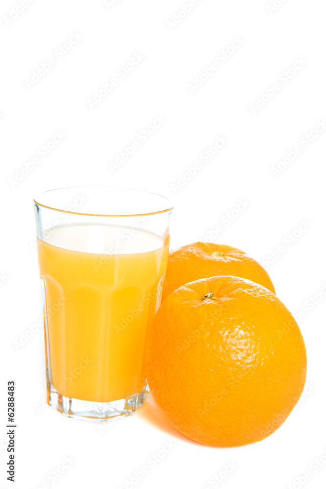 Two oranges and a glass of orange juice Two oranges and a glass of orange juice