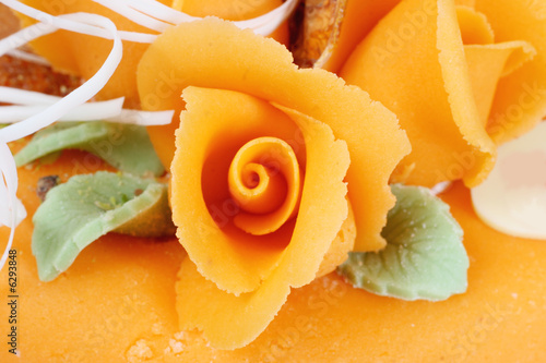 orange cake with orange rooses photo