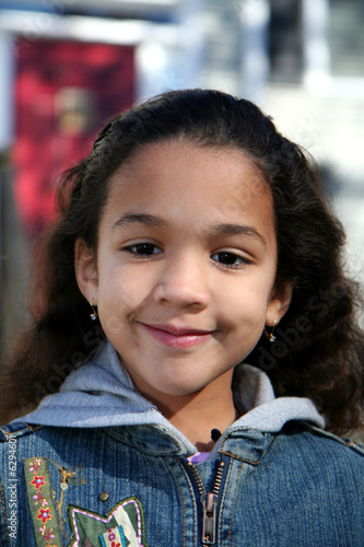 Young girl outside in jean ...