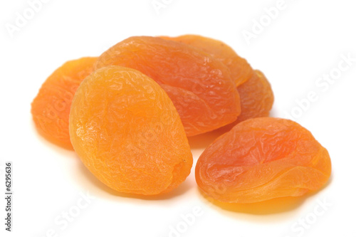 Delicious dried apricots on a white background