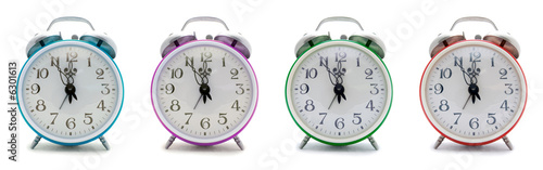 Old alarm clock on a white background