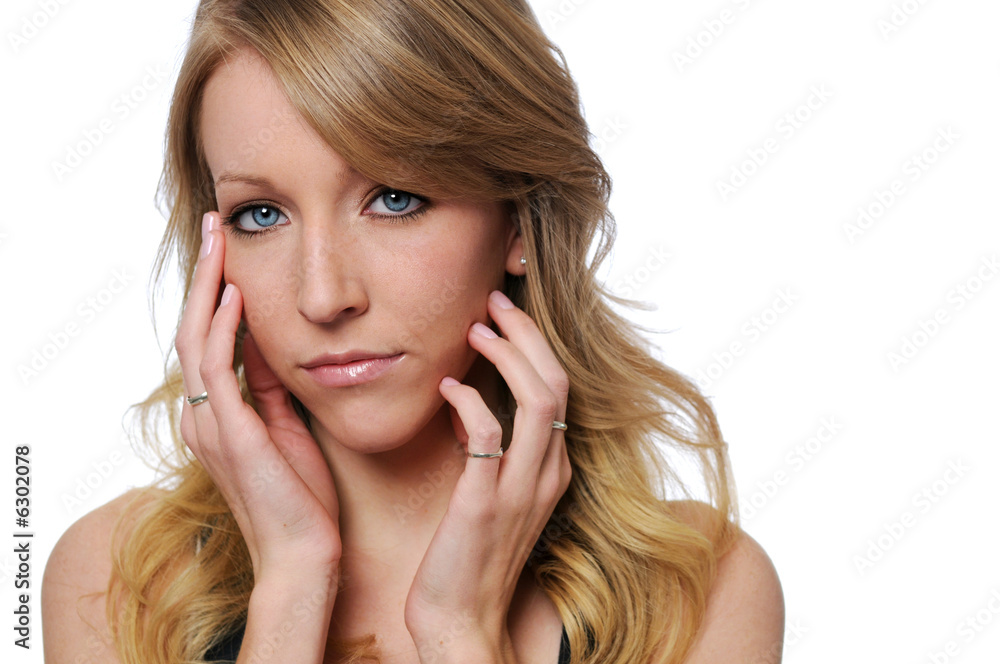 Beautiful young woman with hands on face Beautiful young woman with hands on face