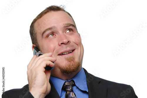 Bussinessman on the cell phone isolated on white