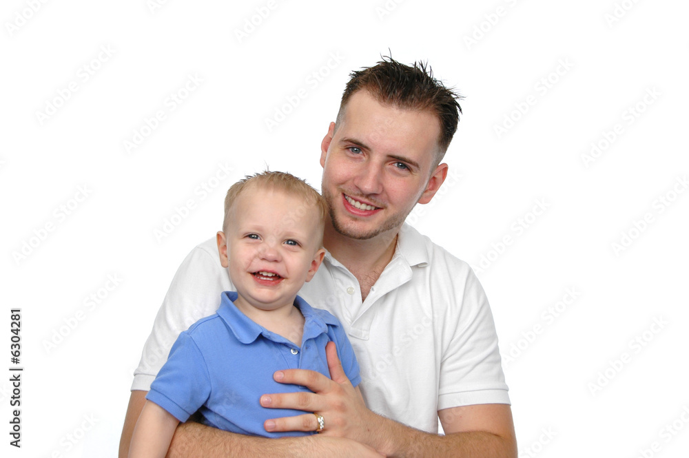 Father and son smiling agains a white background