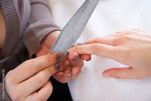 Polishing of a surface of a nail