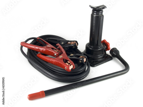 car jack lug wrench and jumper cable