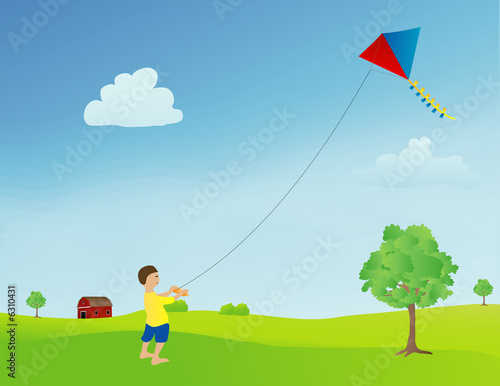 boy flying a kite in an open field