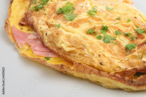 Εκτύπωση καμβά Freshly made omelet filled with ham and cheese