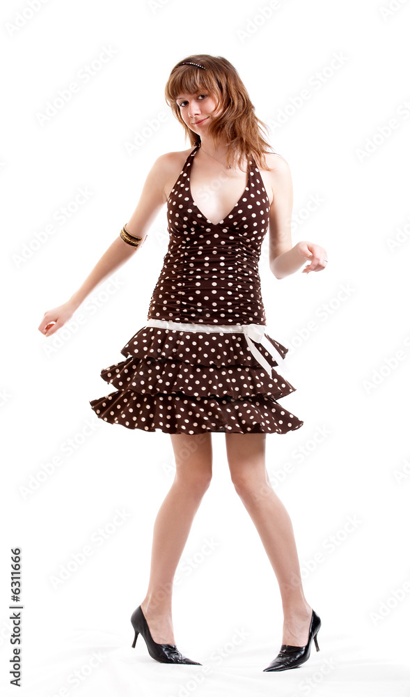Young girl in summer clothes isolated at the white background Young girl in summer clothes isolated at the white background