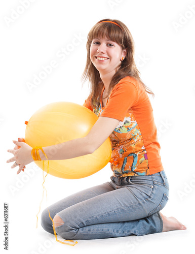 Girl with yellow balloon isolated at the white background