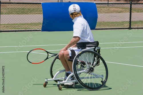 A wheelchair bound athlete on the tennis court