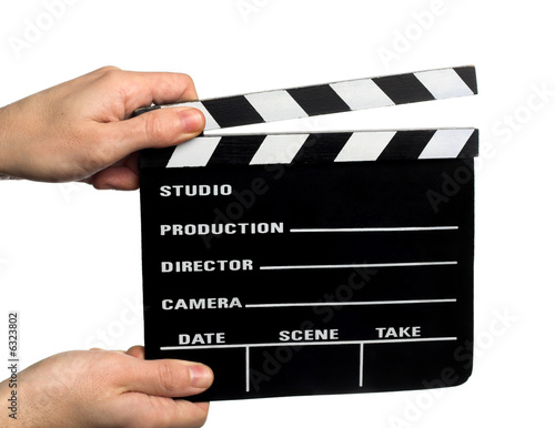 hands holding a movie clapper