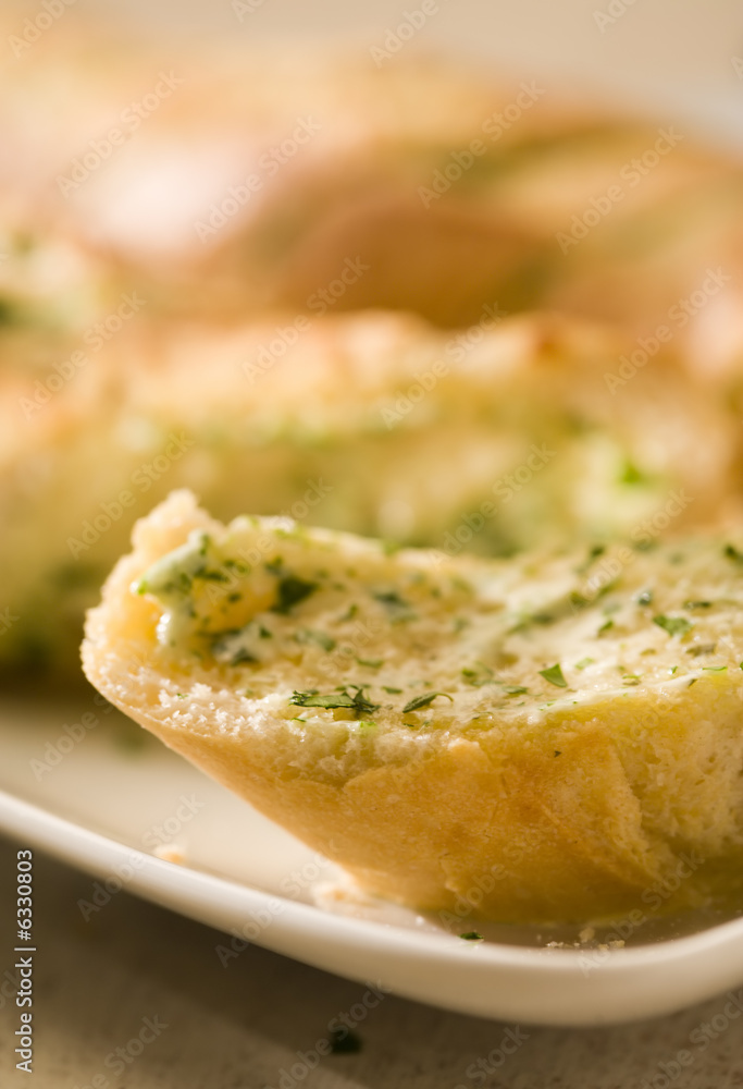 close-up of baguette with herb butter, soft focus close-up of baguette with herb butter, soft focus