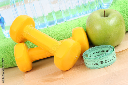 dumbbells towel and green apple - ready to fitness