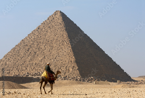 Bedouin on camel near of pyramid in Egypt