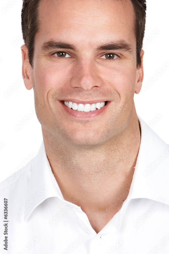 Fototapeta premium Smiling businessman. Isolated over white background.