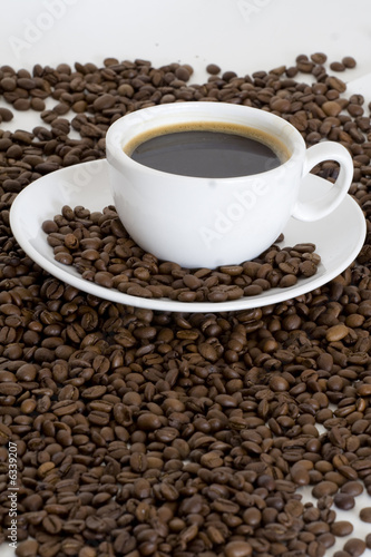 Cup of coffee an coffee beans background