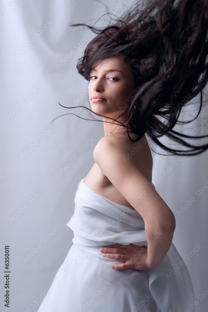 Naklejka premium portrait of a beautiful woman with flying hair
