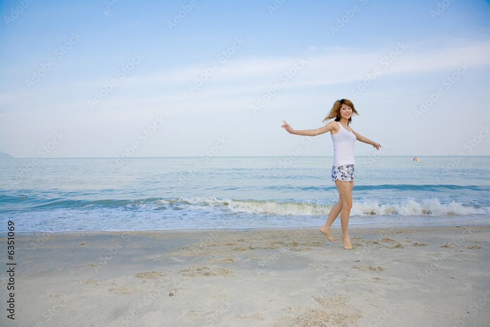 woman having fun by the beach