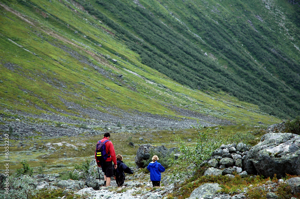 family walking in the mountains