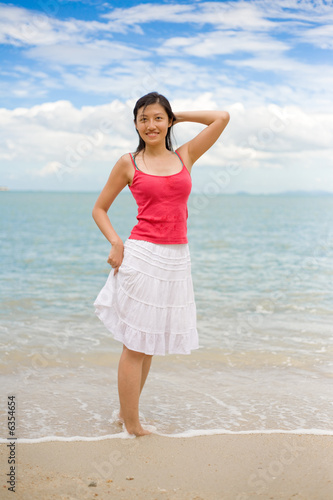 happy red tank top woman at the beach