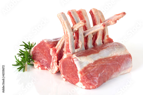 Obraz na płótnie Racks of lamb, ready for cooking, with fresh rosemary.