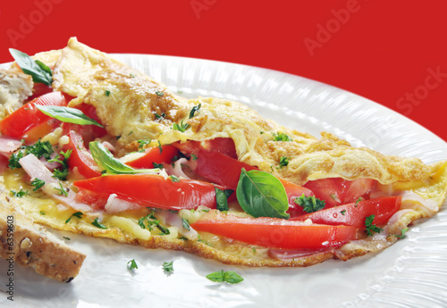 French omelette, with tomato, ham, cheese and basil.  