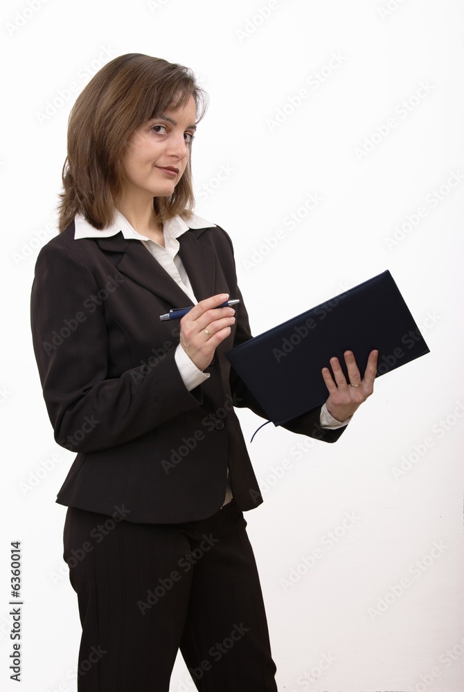 Isolated smiling business woman holding pen and notepad. Isolated smiling business woman holding pen and notepad.