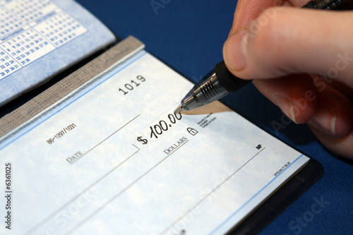 Writing a check in order to pay bills