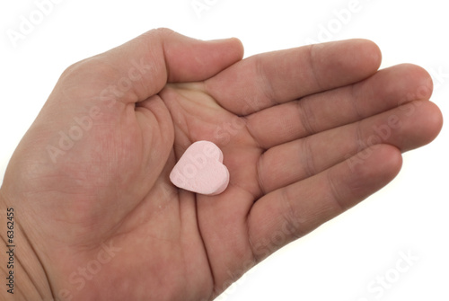 hand with heart shaped sweet
