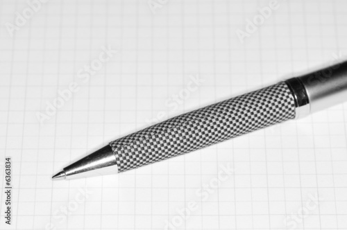 Chess pen laying on paper