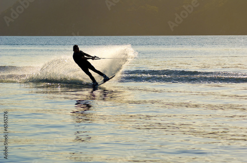 sunset Waterskier sprays water Pittwater  Australia