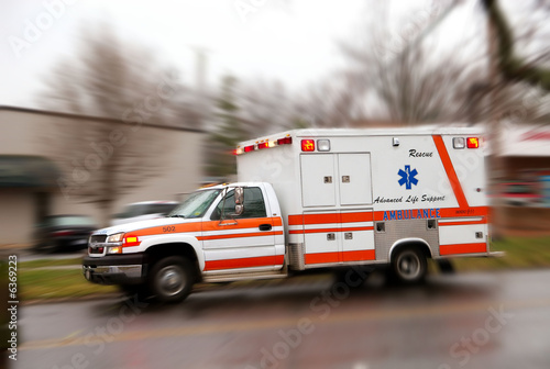 A moving ambulance on it''s way to a crash site.
