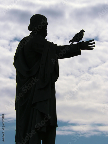 Statue and Bird photo
