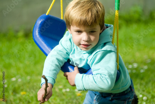 boy in swing