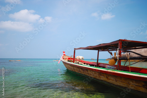 longtail taxi-boat heading to the sea