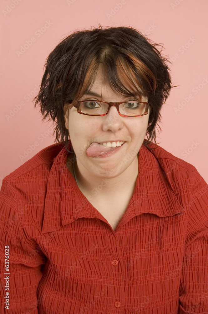 young beautiful woman sticking out tongue