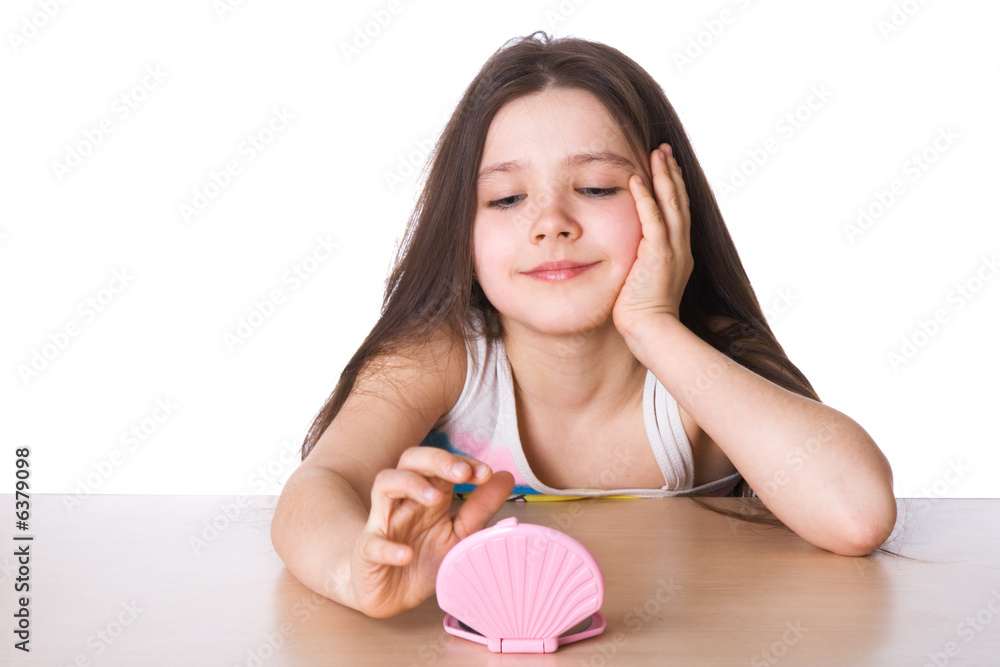 Beautiful little girl admires itself in a mirror Beautiful little girl admires itself in a mirror