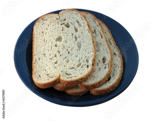 Rye Bread on a blue plate isolated on white