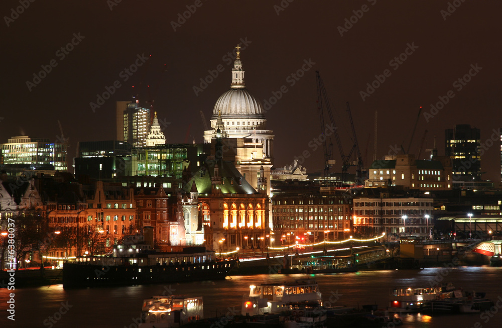 St. Pauls cathedral at night across the Thames