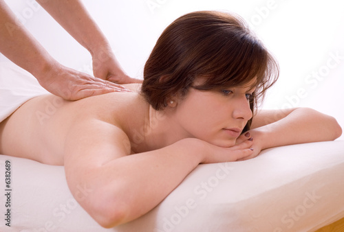 girl getting massage, lying down