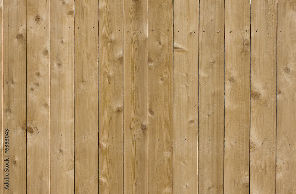 new cedar wood fence background in sunlight new cedar wood fence background in sunlight