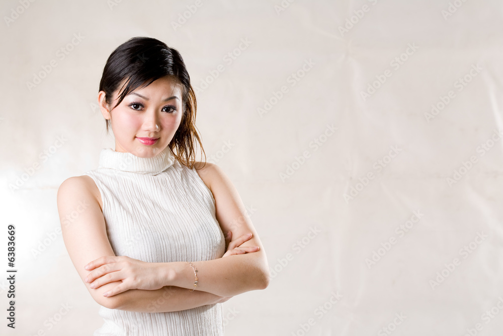 young asian woman in a cross hands position young asian woman in a cross hands position