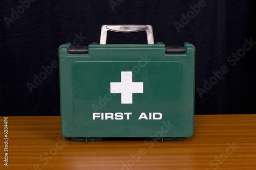 A green first aid kit