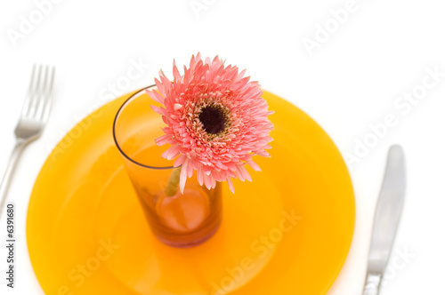 Yellow plate and table utensils isolated on the white
